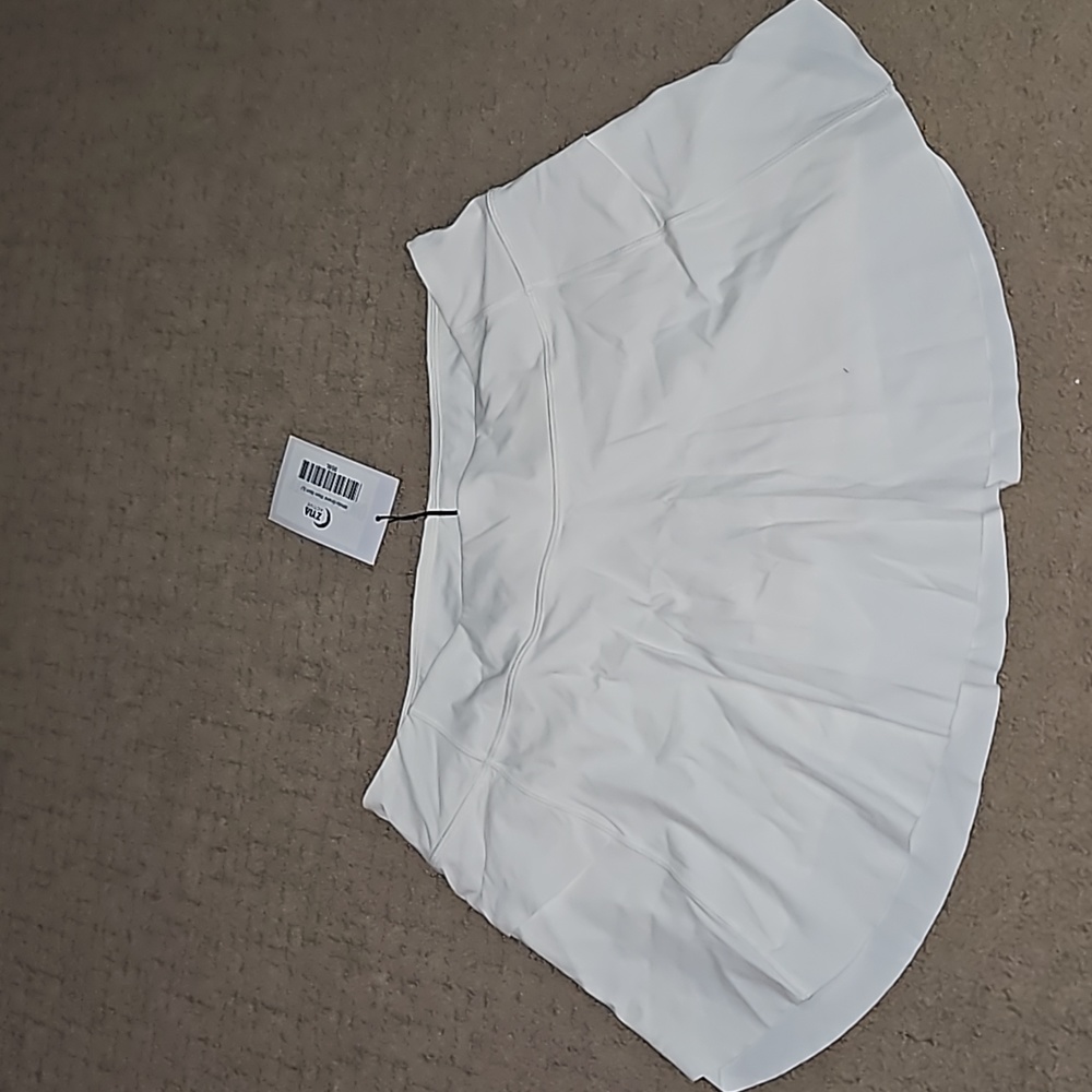 ZYIA white grand slam skirt large